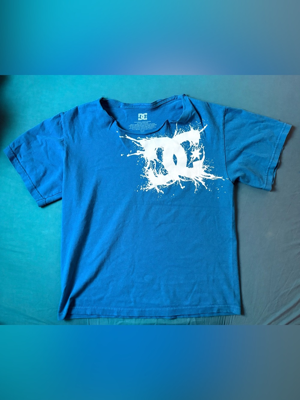 DC Blue Off Shoulder Tee with White Splash Logo